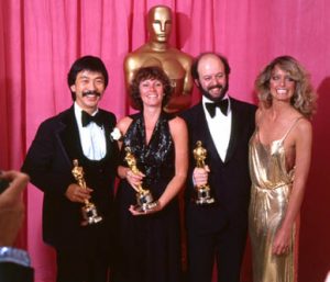 From left: Richard Chew, Marcia Lucas, Paul Hirsch, and Farrah Fawcett at the 1977 (50th) Academy Awards ceremony.